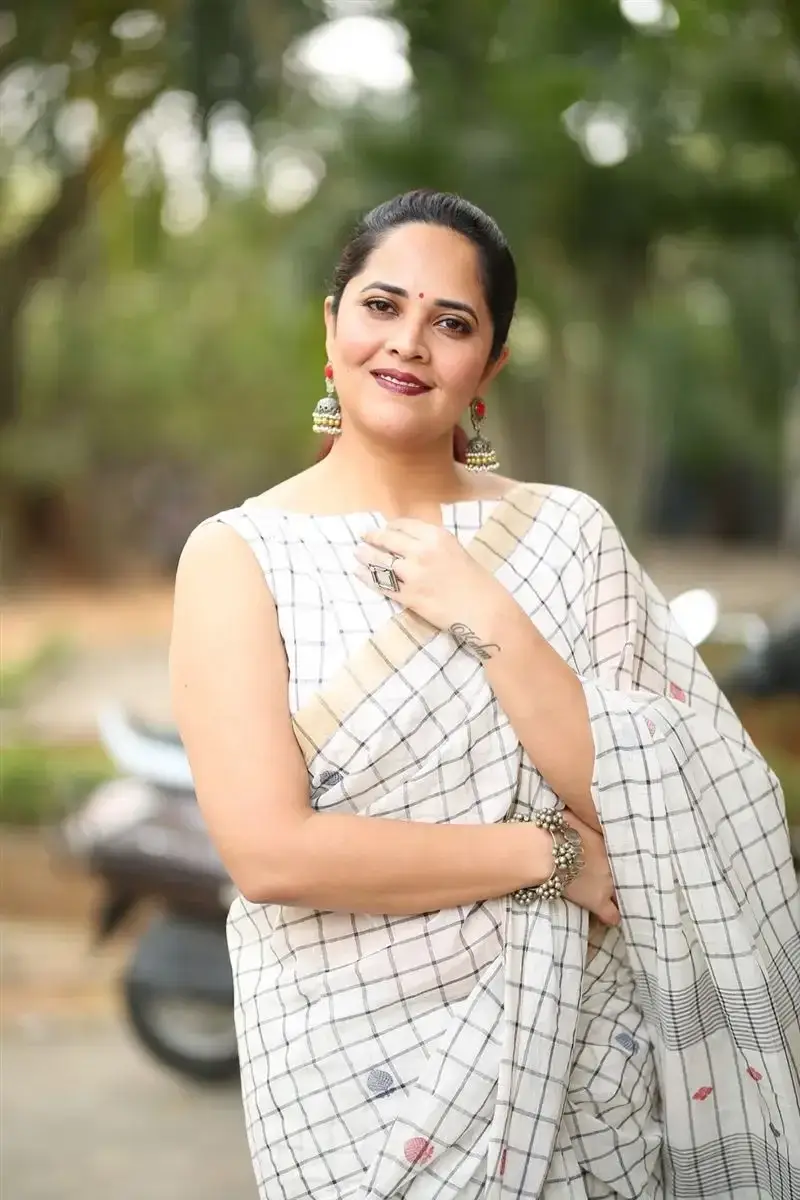 Anasuya Bharadwaj in White Saree at Razakar Movie Launch